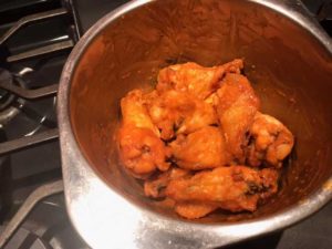 Buffalo chicken wings tossed in sauce