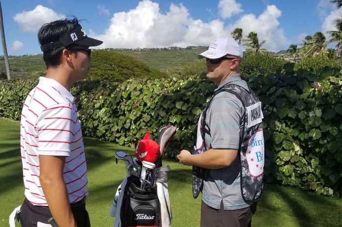 caddie and player in Hawaii photo by Staff Sgt. John Potela
