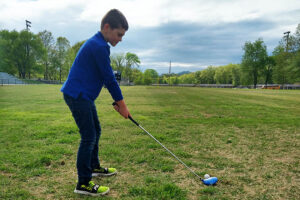 Howard Bankhead tutors a golf student
