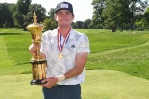 Nick Dunlap with Amex Trophy