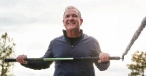 Man using Golforever training device